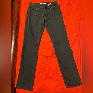 Black Tommy Hilfiger jeans. Straight leg, no fade, no holes.